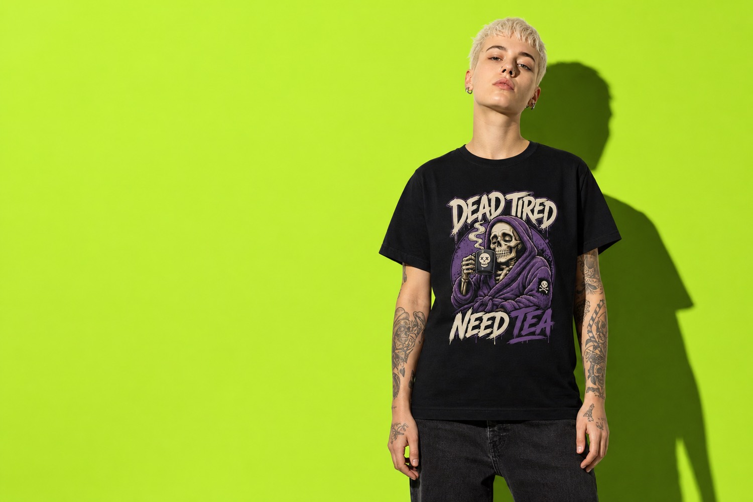 Model wearing the black Dead Tired Need Tea t-shirt against an acid green backdrop